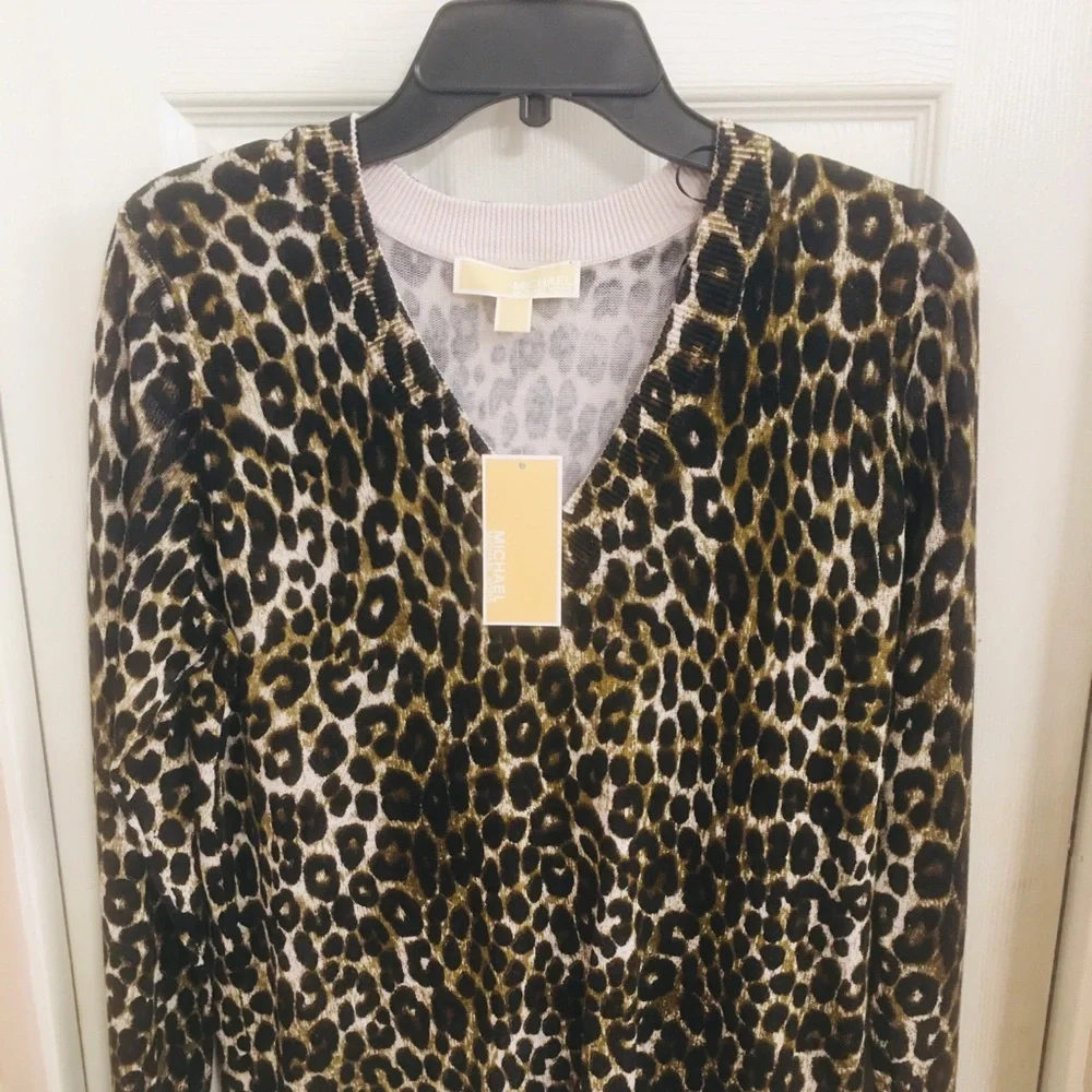 Mk sweater over size will fit a med. cheetha p